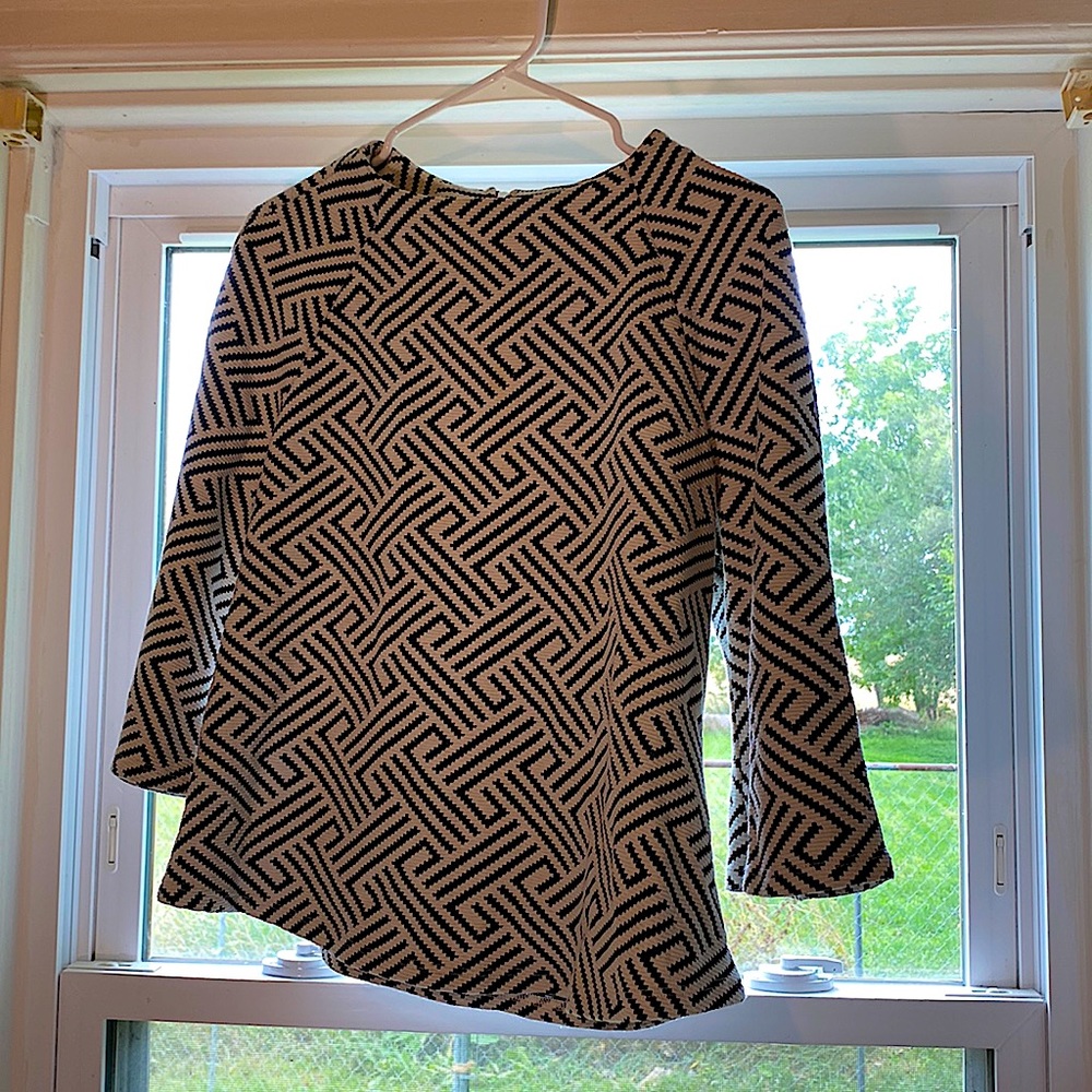 Medium Stripped black and white long sleeve shirt.